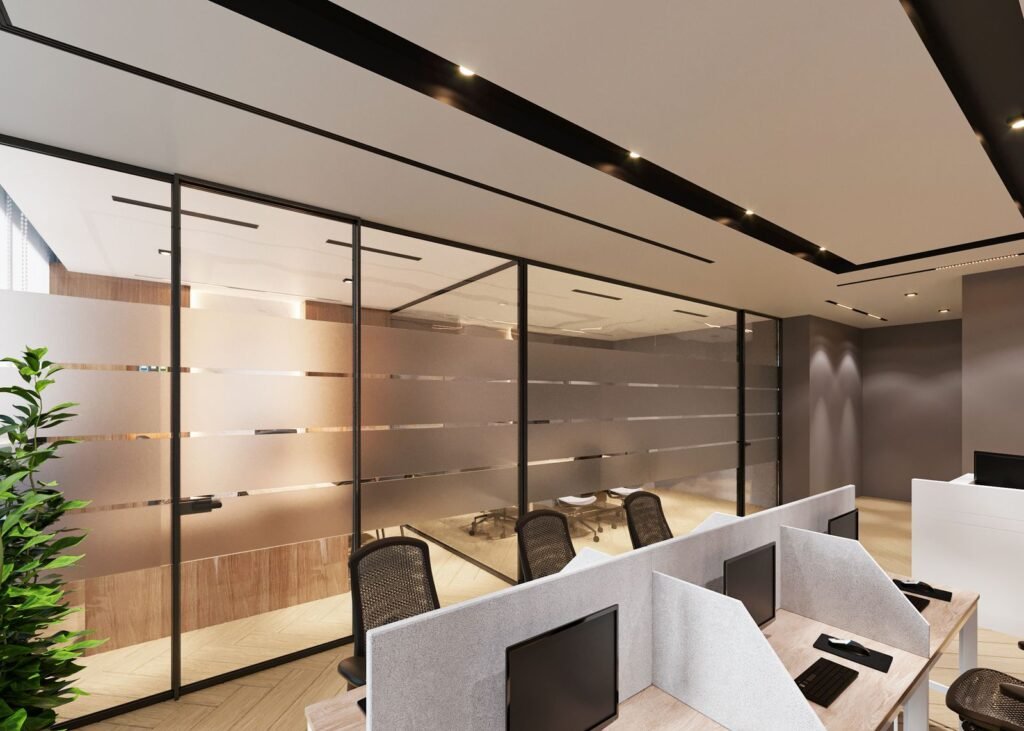 Modern open office interior with cubicles and glass partition walls